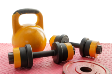 Old kettlebell and dumbbells on the floor with weights for fitness training. Healthy lifestyle concept. Home gym. Space for text. Partially cut out, on isolated white.