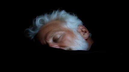 Senior man sleeping peacefully in darkness