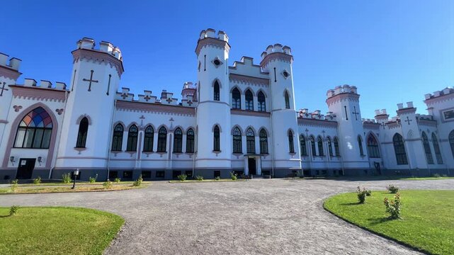 The Puslovsky Palace in Belarus. The Kossovsky Autumn Castle. An old historical castle in Kosovki in sunny weather in autumn. An architectural monument in the style of English Neo-Gothic. 4K