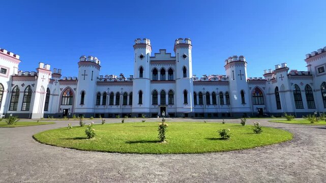 The Puslovsky Palace in Belarus. The Kossovsky Autumn Castle. An old historical castle in Kosovki in sunny weather in autumn. An architectural monument in the style of English Neo-Gothic. 4K