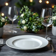 Elegant Table Setting With White Plate and Wine Glasses