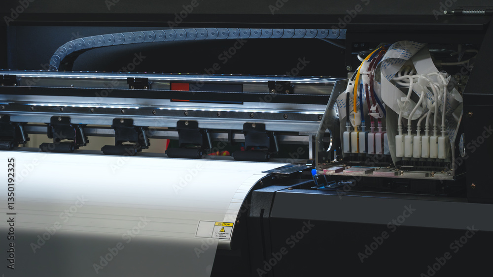 Poster a printer is open and has a white sheet of paper inside. the printer is black and has a yellow and r