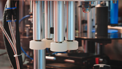 Fragment of the conveyor of sticking labeling machine for packaging food products or...