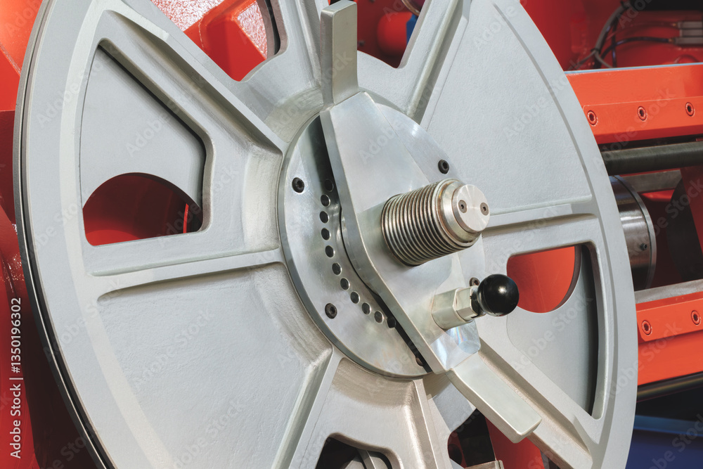 Aufkleber A silver wheel with a black handle is on a red background. The wheel is in the center of the image and is surrounded by a red frame