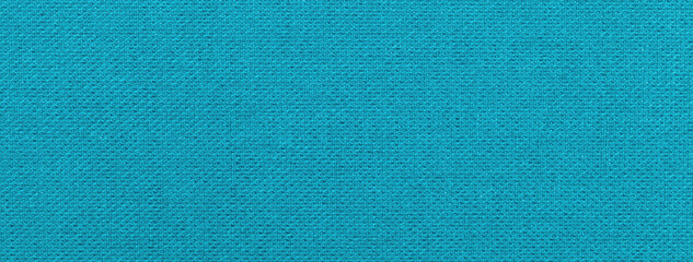 Texture blue background from textile material with wicker pattern, macro. Structure vintage turquoise fabric cloth