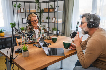 mature woman guest in podcast answering on questions to man host