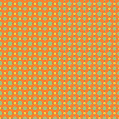 Fototapeta premium Colorful geometric dot pattern in orange and green, repeated circles and squares for backgrounds, textiles, and decor