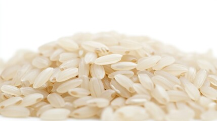 Close-up of a pile of uncooked white rice grains against a white background.