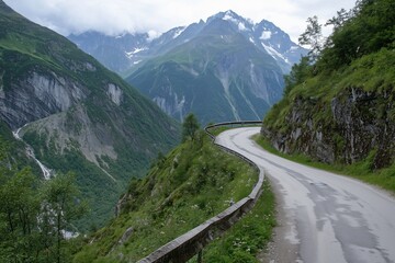 Fototapeta premium Winding Mountain Road Through Lush Green Valley, Scenic Driving Route