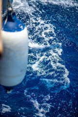 Close-Up Fender View on Sailboat with Ocean Waves