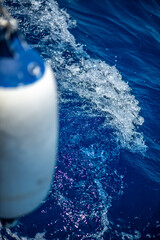 Close-Up Fender View on Sailboat with Ocean Waves