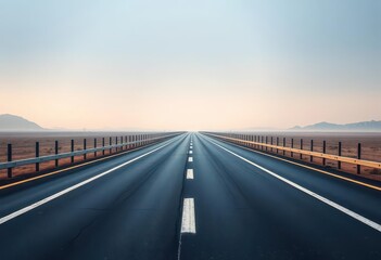 Fototapeta premium Endless asphalt ribbon vanishing into hazy distance, straight, light