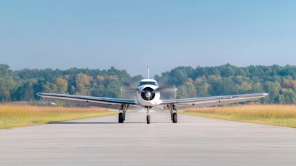 Small white airplane on runway, ready for takeoff.  Gentle breeze