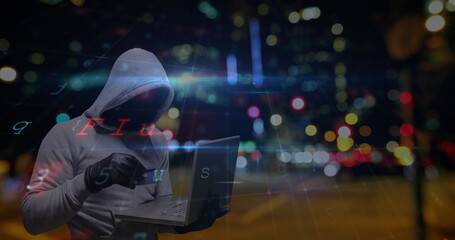 Hooded figure using laptop at night, digital interface overlay with city lights