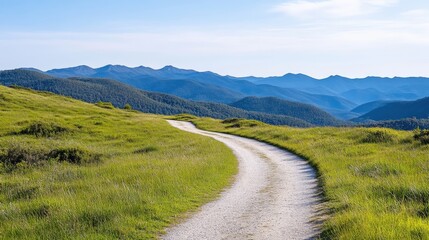 Serene mountain path winds through grassy hills