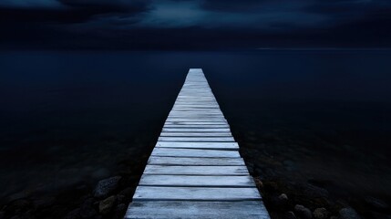 Obraz premium Lonely wooden pier extending into a dark lake at night