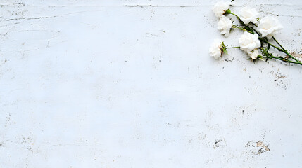 White roses on rustic wood background; space for text; wedding invitation design