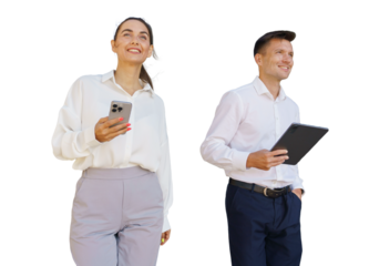 Young professionals enjoying their time while using mobile devices outdoors in a bright setting