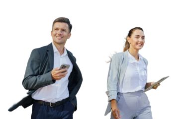 Business professionals walking outdoors, engaged in conversation and using mobile devices