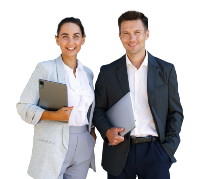 Professional business couple posing together outdoors with laptops, smiling confidently in business attire