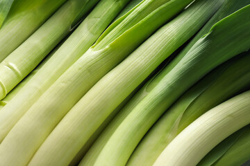 Fresh raw green leeks as background, top view