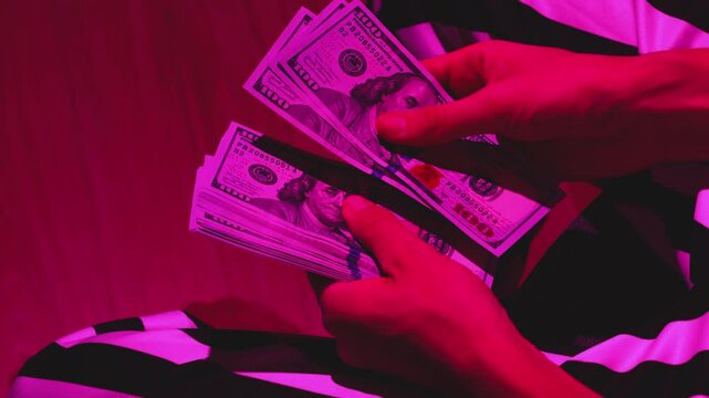 Counting Money Under the Glow of Neon Light, Aesthetic Banknotes and Vibrant Cash in Focus