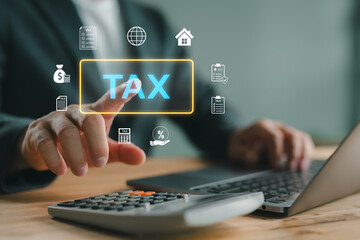 E-tax, Businessman show TAX for Individual income tax return form online for tax payment concept....