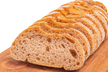 Bread cut into slices on a wooden board. Buckwheat bread.