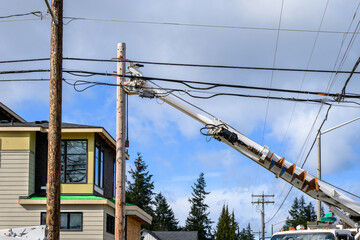 Utility digger derrick truck with pole setting equipment, ready to remove temporary wood powerline...