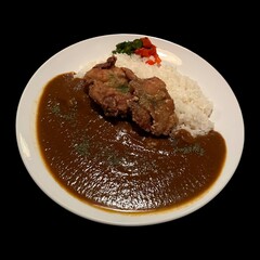 a cuisine photo of fried pork with curry sauce