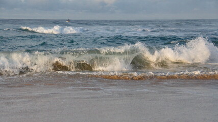 Waves breaking on the beach in Zipolite, Mexico