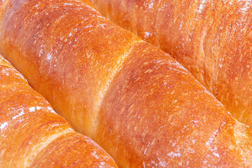 Wheat baguette as a background macro photo. Bread.