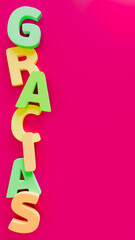 Thank you phrase with green and yellow letters on a violet background, expression of gratitude