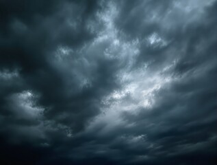 Obraz premium Dramatic storm clouds filling the sky, creating a moody atmosphere. Natural landscape scene with dark clouds forming before a storm. Ai generative