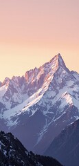Obraz premium Snow-covered mountain peak bathed in golden sunrise light, with a pastel sky in the background. A serene and breathtaking nature landscape. Ai generative