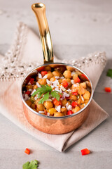 Special Um Jassim Hummus, Chana Chaat, Chickpea Salad served in a copper bowl side view popular Pakistani snack and street food dish