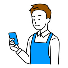 スマートフォンの画面を見るエプロン姿の男性