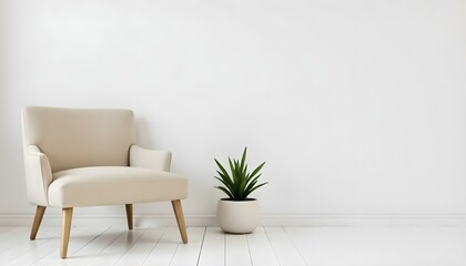 A beige armchair with a plant on a white wooden floor against a white wall in a minimalist living room 