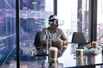 Man using VR headset in modern office, exploring virtual reality technology