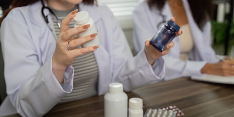 Telemedicine and Pharmaceutical Consultation. Two healthcare professionals discussing medication options in a modern telemedicine setting.