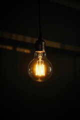 there is a light bulb that is hanging from a wire