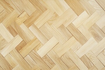 Light wood herringbone parquet flooring texture.