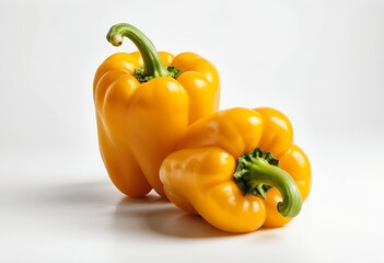 Two Fresh Yellow Bell Peppers on White Background