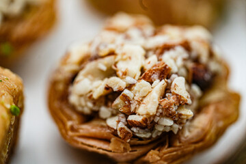 Baklava is a layered pastry dessert made of filo pastry, filled with chopped nuts, and sweetened with syrup or honey.