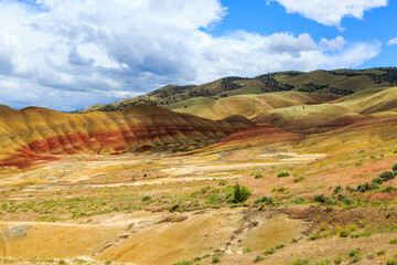 North America, United States, Oregon, Central Oregon, Redmond, Bend, Mitchell. Series of low clay hills striped in colorful bands of minerals, ash and clay deposits.