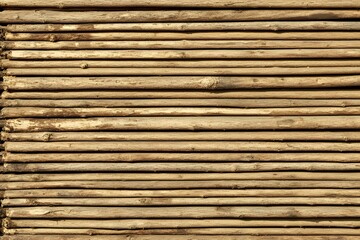 Stacked Wooden Poles Rustic Brown Texture Background