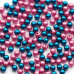 Pink and Teal Pearl Beads Scattered on White Background