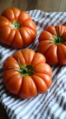 Juicy Heirloom Tomatoes on Striped Fabric