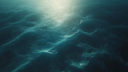 Mesmerizing view of the ocean with sunlight beautifully shining through the water creating stunning aqua shapes and glimmering reflections.