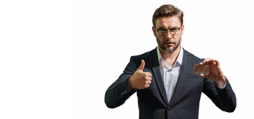 Studio portrait of man with a credit card on gray isolated background. Money management and credit...
